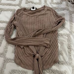 Long sleeve brown shirt with tie in the center